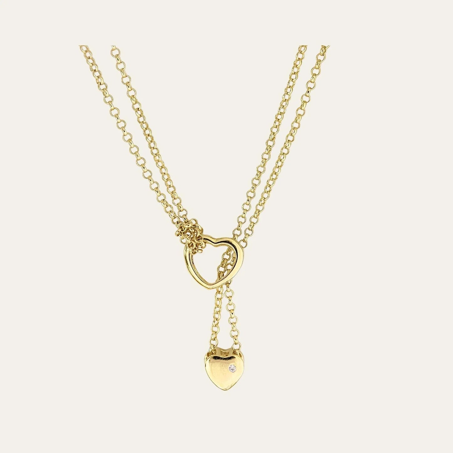 Collar enchapado en oro, con doble corazón, y doble cadena, con circón en la parte lisa de atrás del corazon más pequeño