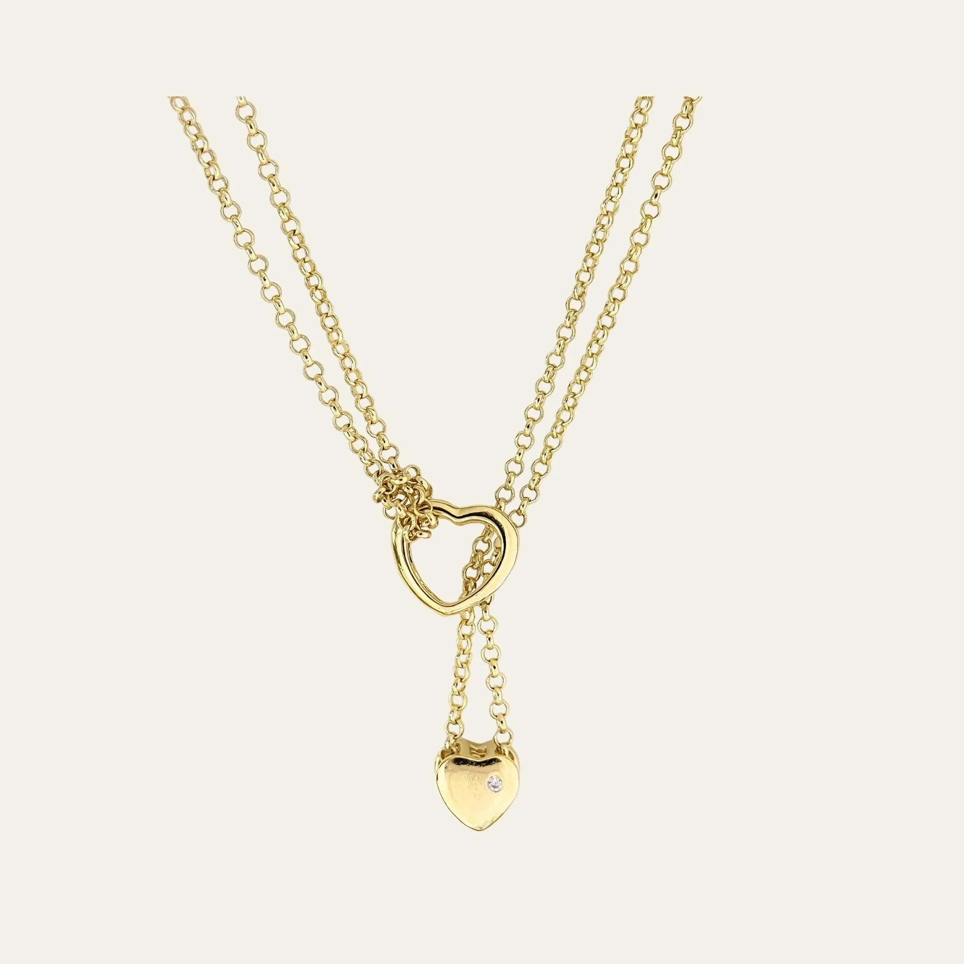 Collar enchapado en oro, con doble corazón, y doble cadena, con circón en la parte lisa de atrás del corazon más pequeño