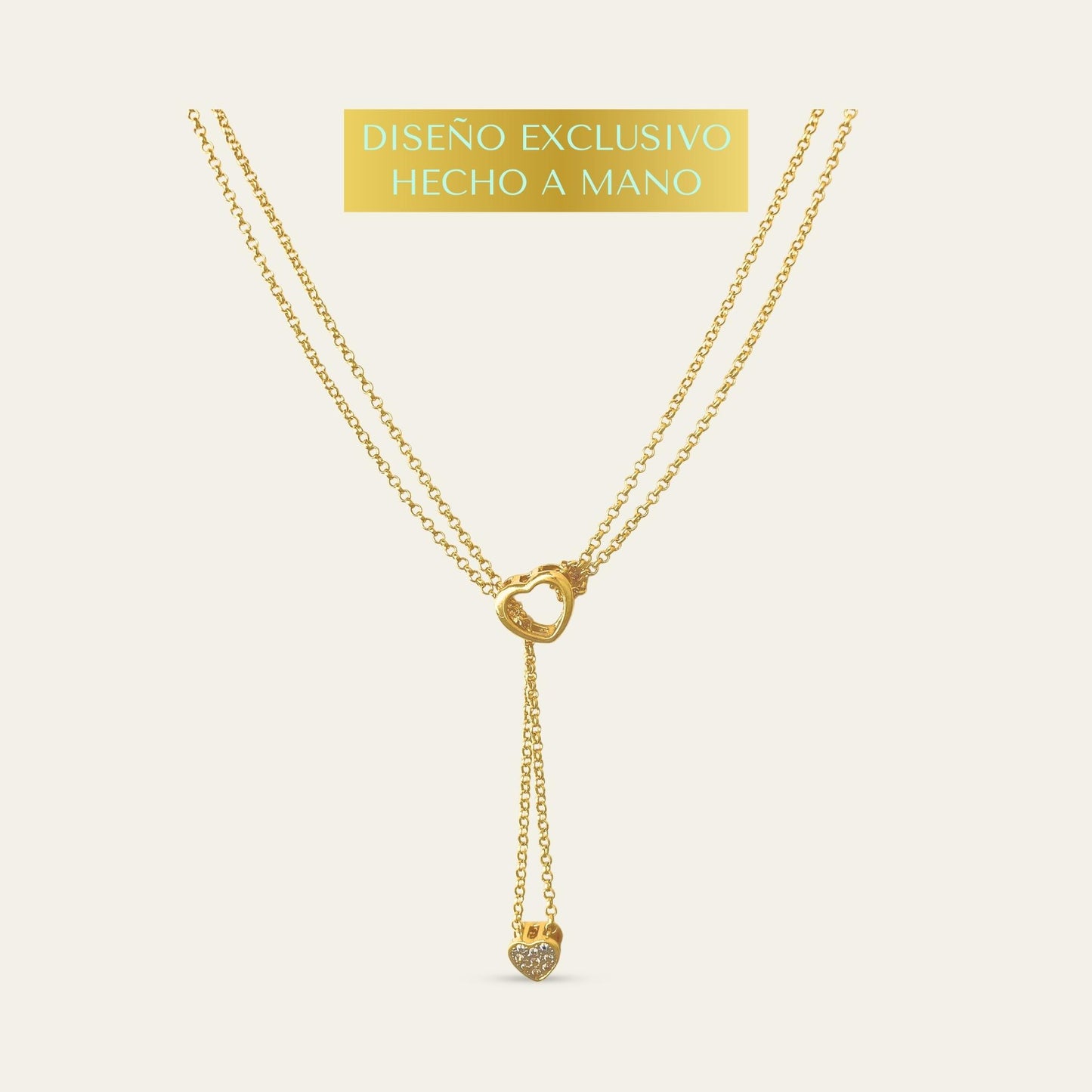 Collar exclusivo de doble cadena con corazones móviles y circones, enchapado oro 18kt sobre fondo blanco - Coca Johnson Joyas - Chile