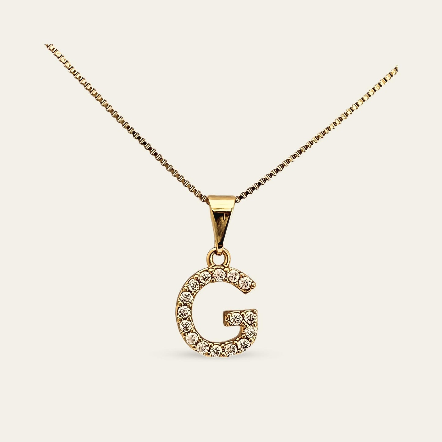 Colgante de letra inicial G enchapado en oro con circones 