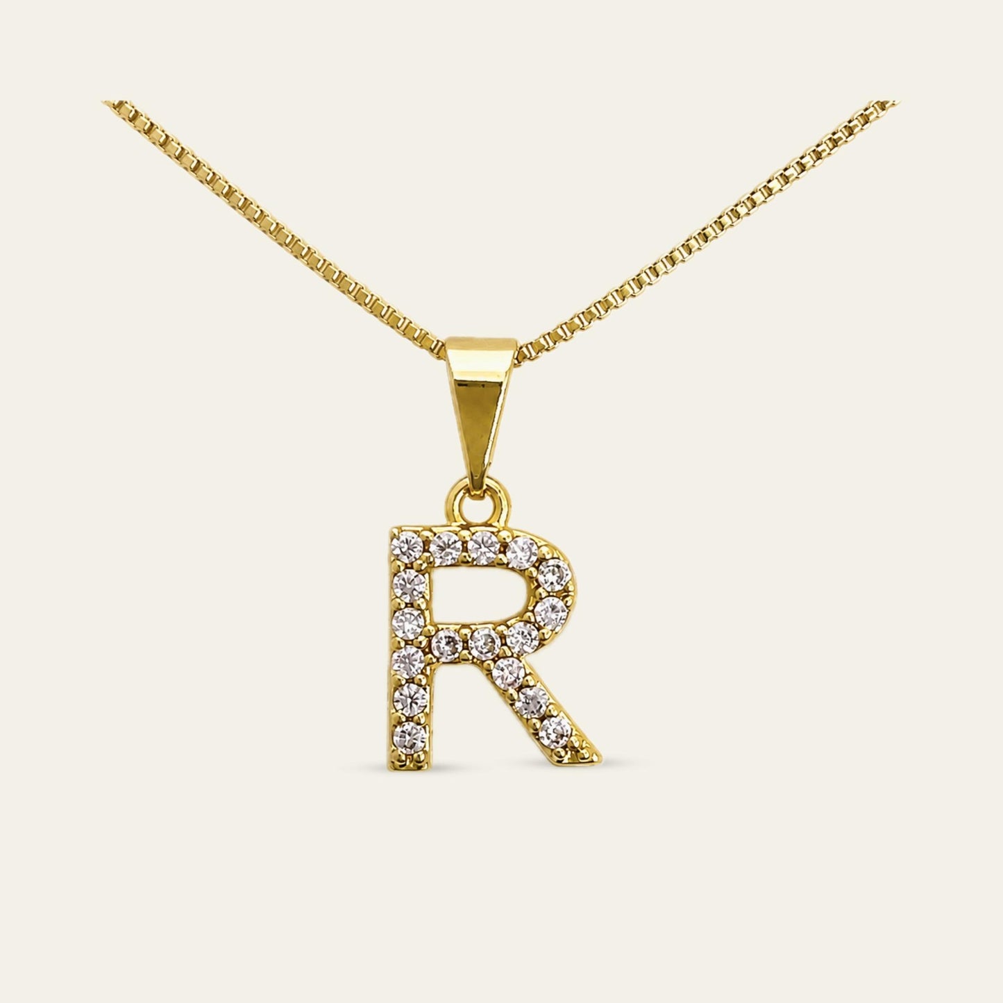Colgante de letra inicial R enchapado en oro con circones 