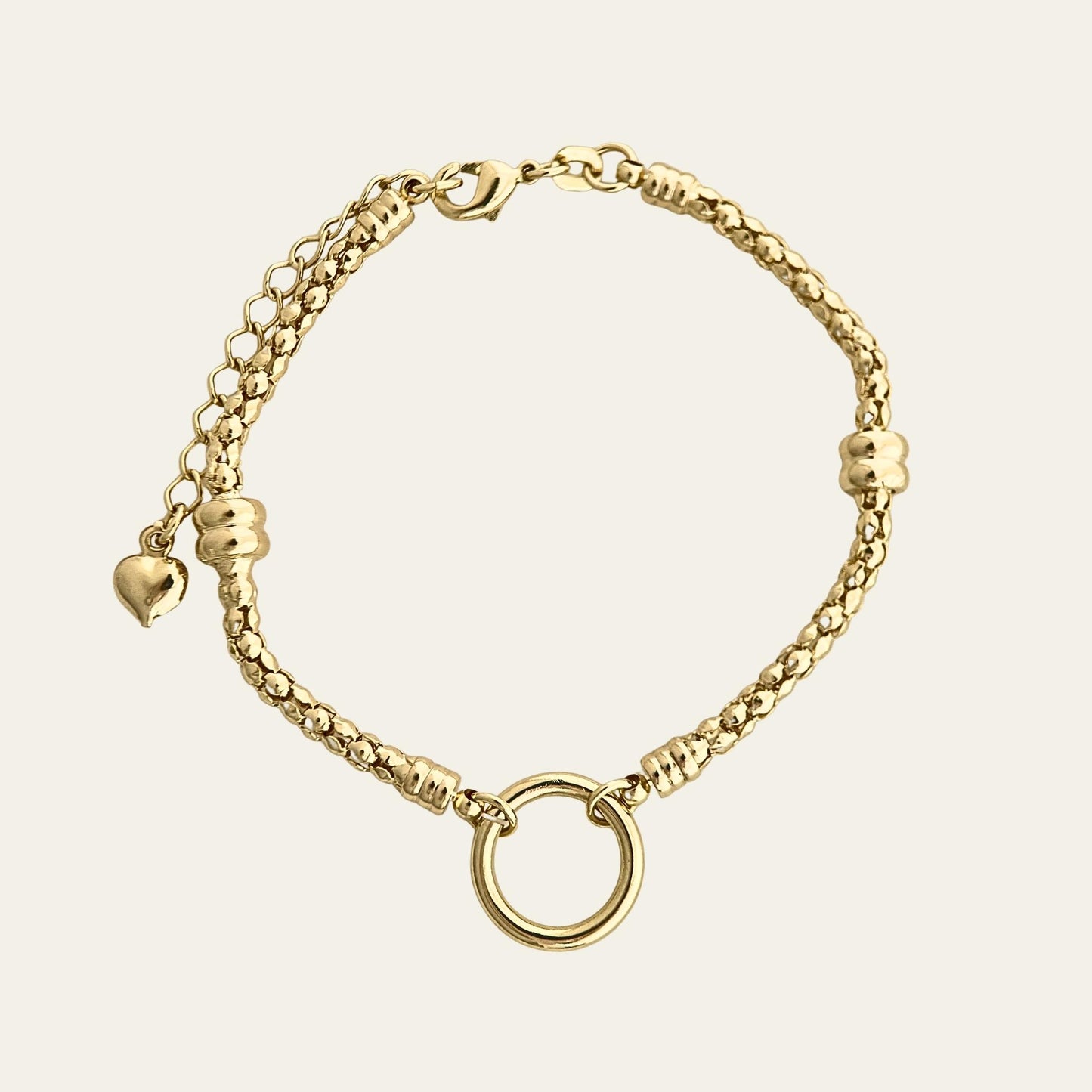 Pulsera tipo pandora, enchapada en oro de 18kt, sobre fondo blanco - Coca Johnson Joyas - Chile