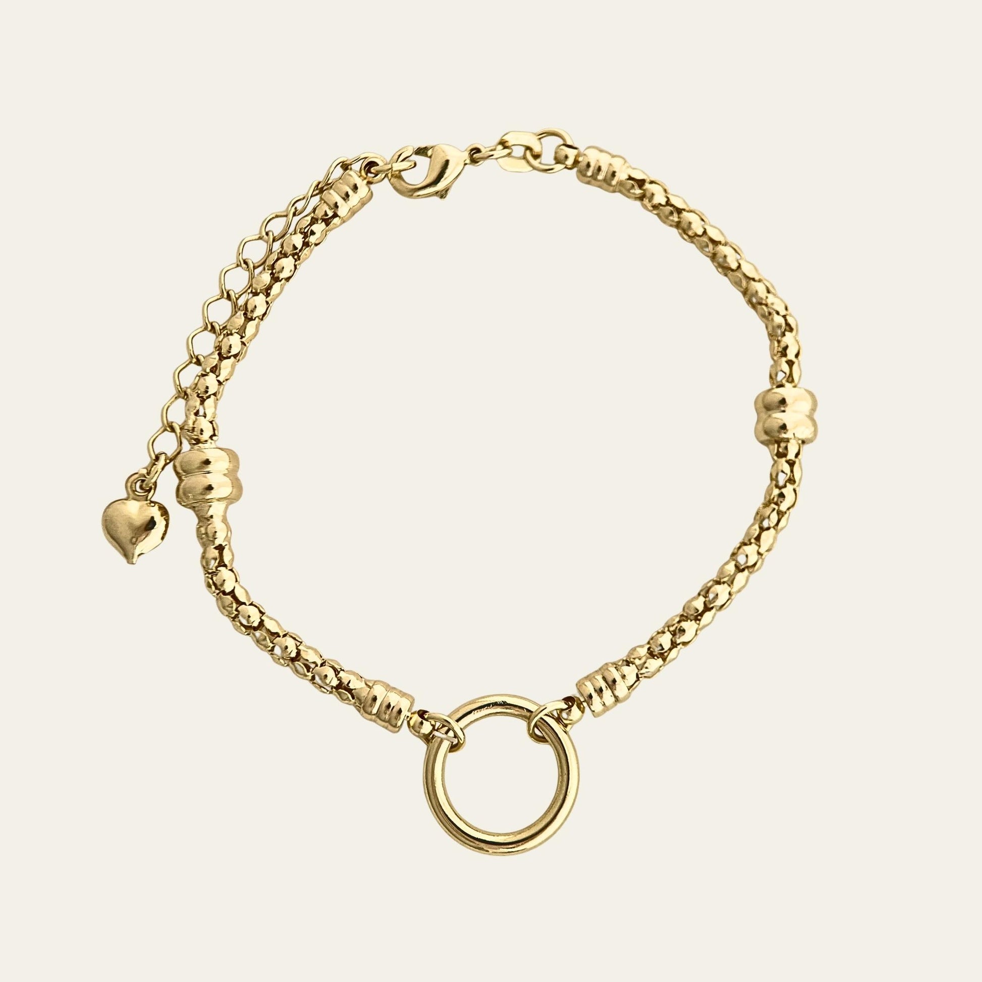 Pulsera tipo pandora, enchapada en oro de 18kt, sobre fondo blanco - Coca Johnson Joyas - Chile