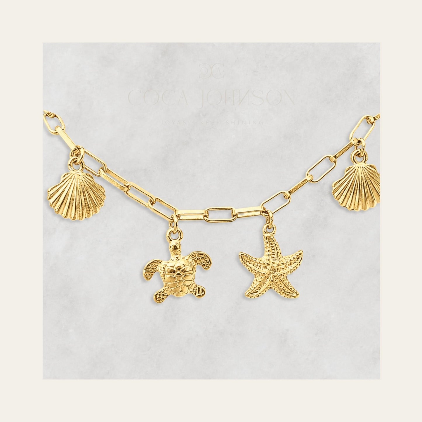 Pulsera de eslabones enchapada en oro de 18 Kt zoom a los charms marinos Coca Johnson Joyas - Chile